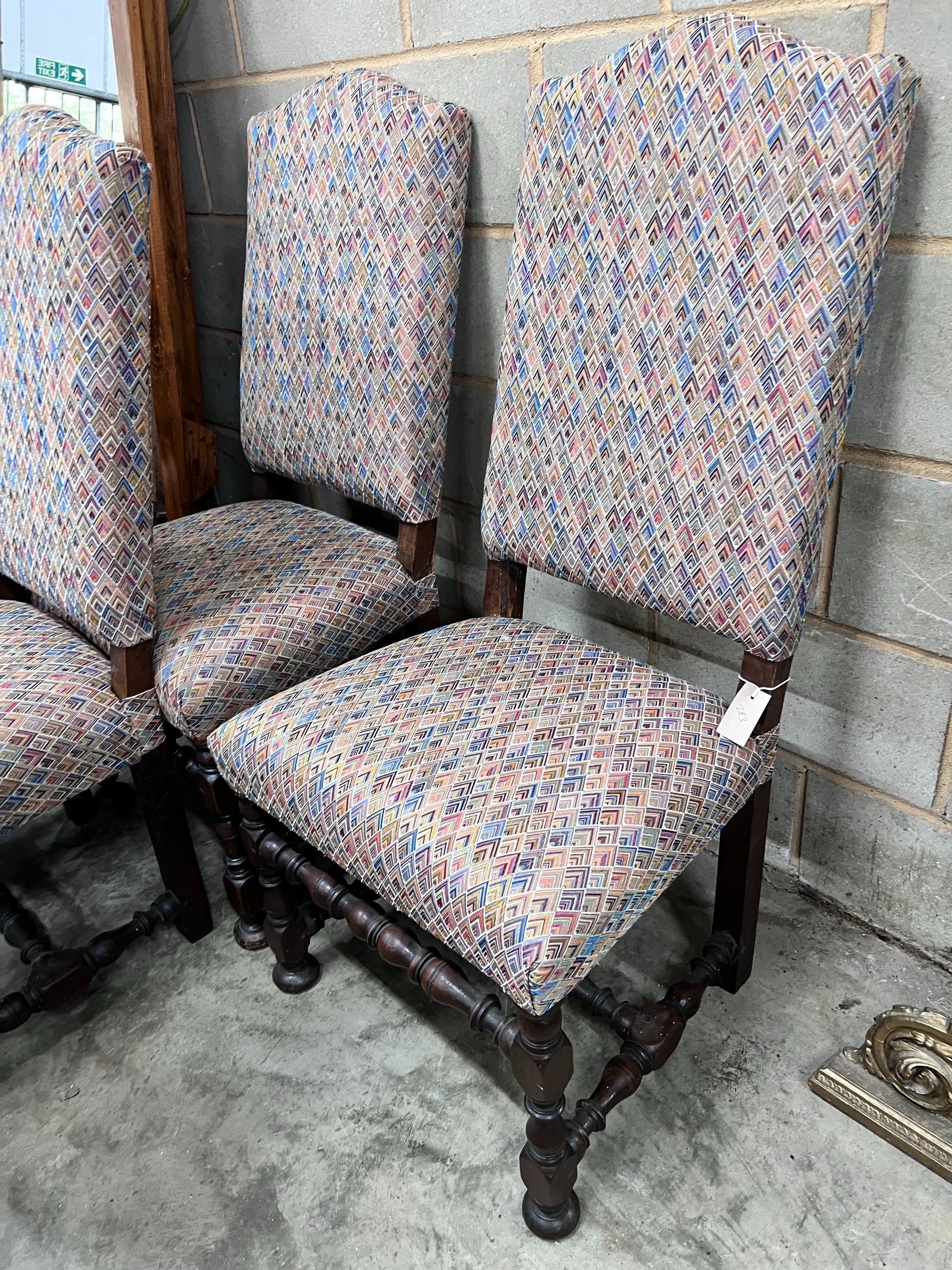 A set of four 17th century style Spanish walnut dining chairs, with upholstered backs and seats *Please note the sale commences at 9am.